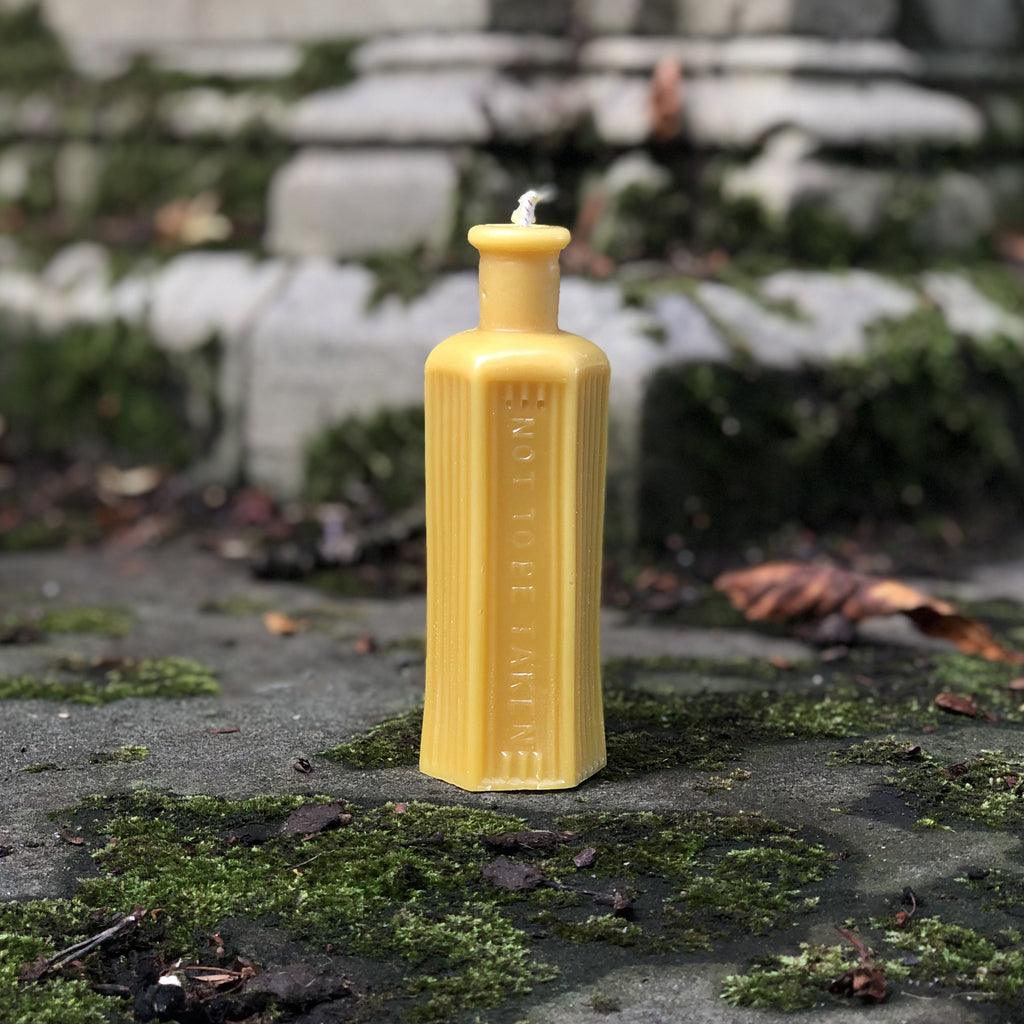 This quirky poison bottle - shaped beeswax candle is created from an actual vintage poison bottle! (which we ourselves are big collectors of...) Distinctive to the touch so that you wouldn't reach for the wrong bottle on those long, dark winter nights, this quirky candle would make the perfect unique bit of home decor and burns for approximately 20 hours!