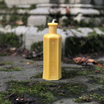 Load image into Gallery viewer, This quirky poison bottle - shaped beeswax candle is created from an actual vintage poison bottle! (which we ourselves are big collectors of...) Distinctive to the touch so that you wouldn&#39;t reach for the wrong bottle on those long, dark winter nights, this quirky candle would make the perfect unique bit of home decor and burns for approximately 20 hours!
