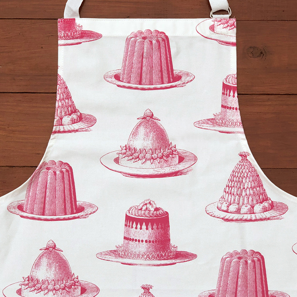 Be the star baker with our gorgeous hand printed 100% cotton aprons! In a mouth watering raspberry pink Jelly & Cake design, this apron conjures up the feeling of kitchens of the past - crafting those perfect creations not just at seasonal celebrations, but all year round! Get practicing in this high quality Thornback & Peel treat!