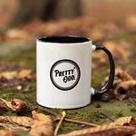 Load image into Gallery viewer, Meet our latest mascot - Winnie! Our witchy familiar adorns our Pretty Odd ceramic mug, perfect for your own blend of witch&#39;s brew! This 11oz (330ml) mug is dishwasher and microwave safe and will look cute perched on your desk this season!

