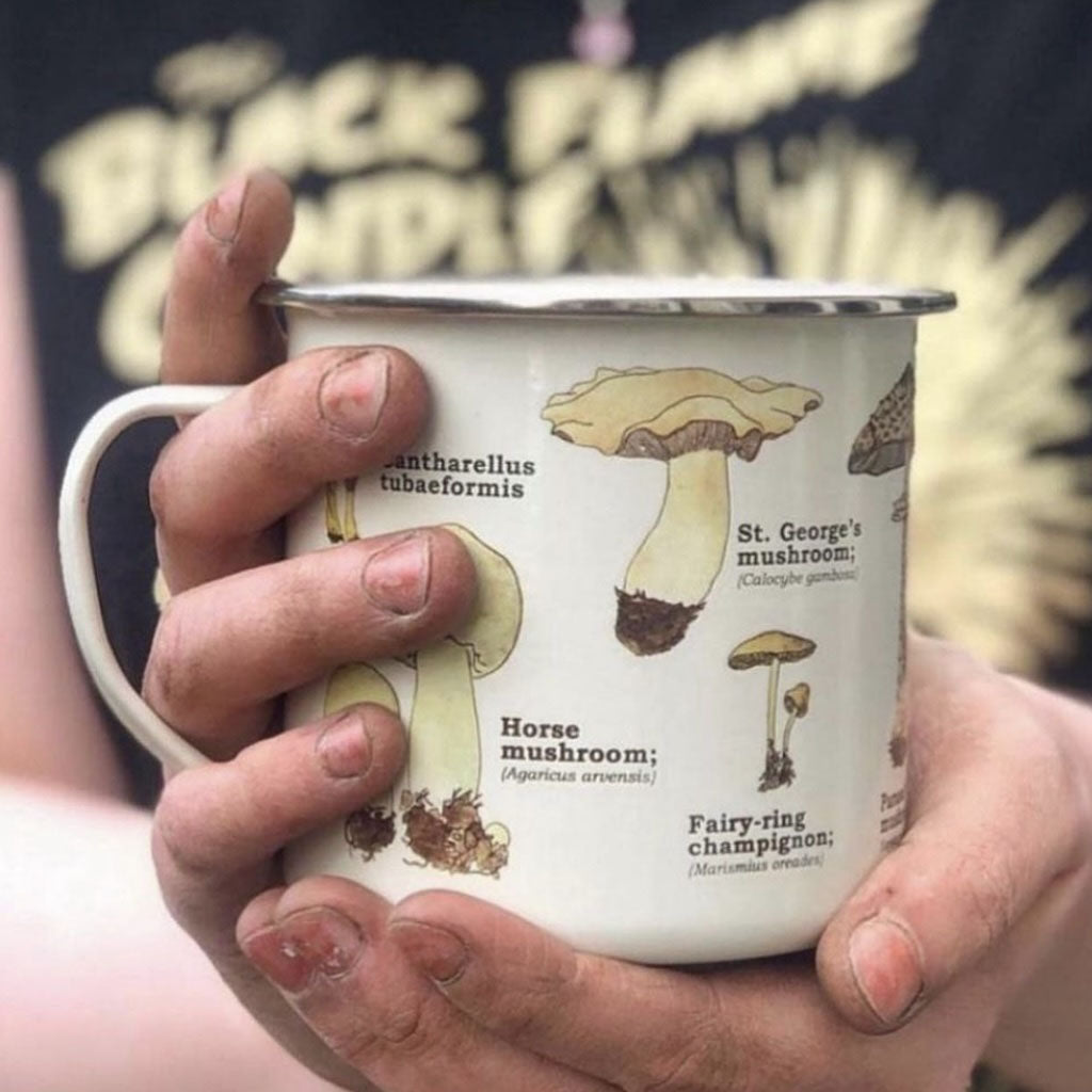 Closeup of enamel mushroom toadstool mug