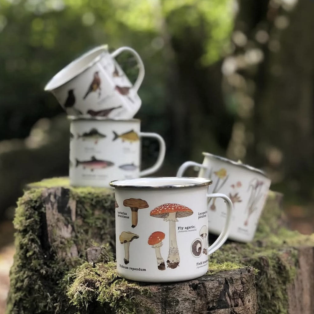 A collection of our enamel mugs with various wildlife-inspired patterns