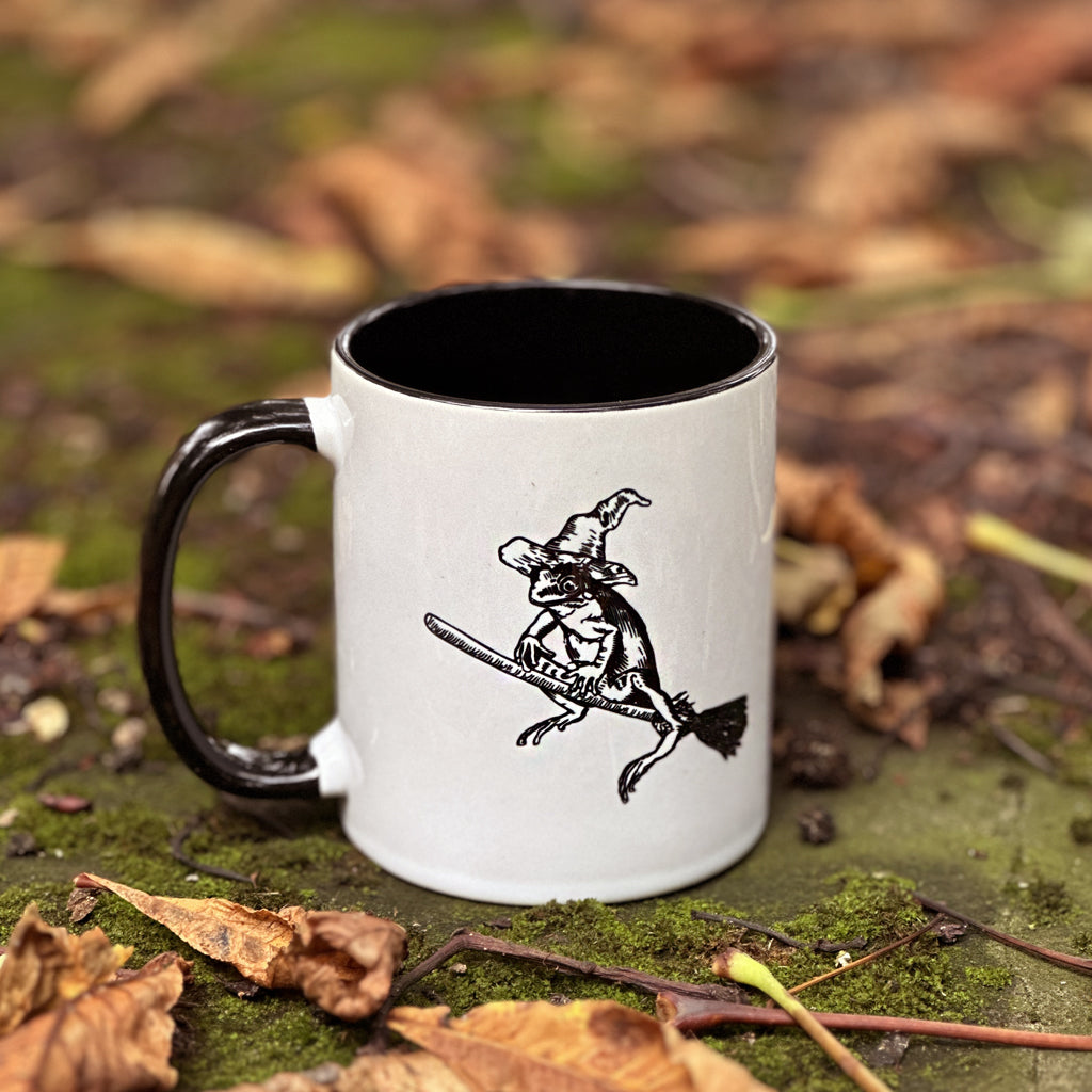 Meet our latest mascot - Winnie! Our witchy familiar adorns our Pretty Odd ceramic mug, perfect for your own blend of witch's brew! This 11oz (330ml) mug is dishwasher and microwave safe and will look cute perched on your desk this season!