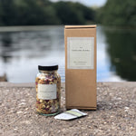 Load image into Gallery viewer, Natural flowers and herbs fill this jar of Reviving Bath Tea. Supplied with paper bags in a recyclable Kraft box, this gorgeous gift is a perfect pre-made care package for somebody you love, or a special treat to look forward to after a hard day.
