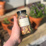 Load image into Gallery viewer, Natural flowers and herbs fill this jar of Reviving Bath Tea. Supplied with paper bags in a recyclable Kraft box, this gorgeous gift is a perfect pre-made care package for somebody you love, or a special treat to look forward to after a hard day.

