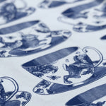 Load image into Gallery viewer, Craft the perfect Afternoon Tea with our exquisite hand printed 100% cotton Teacup apron! In gorgeous blues, this high quality apron will have you looking like a kitchen superstar while protecting you from any potential icing sugar disasters! This Thornback &amp; Peel apron would make a wonderful gift for yourself or a loved one.
